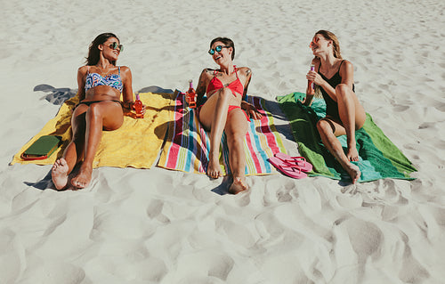 Women sunbathing on beach