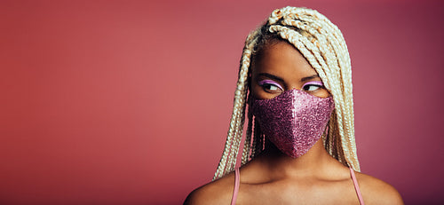 African woman wearing designer face mask