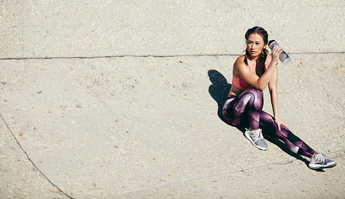 Fitness woman relaxing after workout session