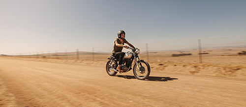 Rider driving motorcycle off-road
