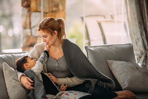 Mother and son having fun while studying