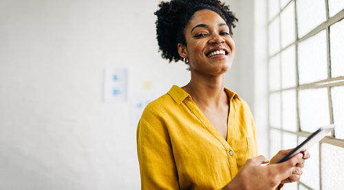 Black business woman working with a digital tablet in a professional office