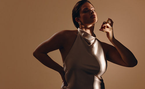 Luxury perfume beauty portrait of an elegant woman in studio