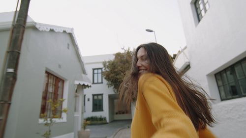 Happy young woman having fun outdoors