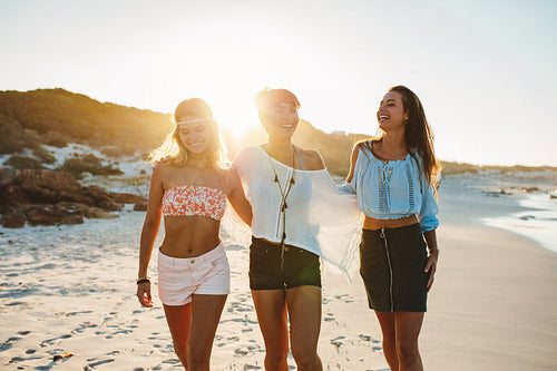 Stylish young women enjoying at the sea coast