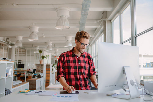 Young man working in modern workplace