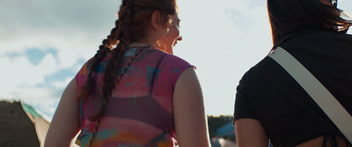 Joyful friends greet each other at a festival