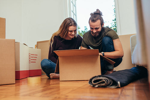 Couple unboxing their household items