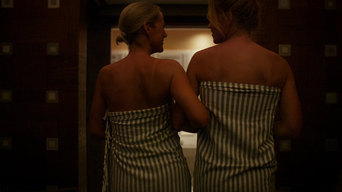 Two women embracing relaxation and wellness in a luxurious spa environment