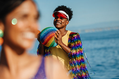 Brazilian carnival friend at beach with bead ball