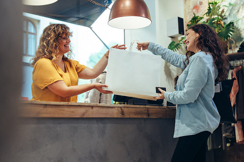 Woman shopping for clothes at a fashion store