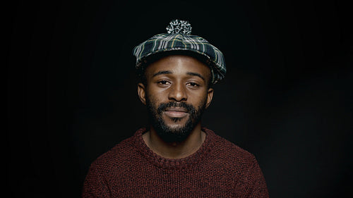 African man in scottish cap