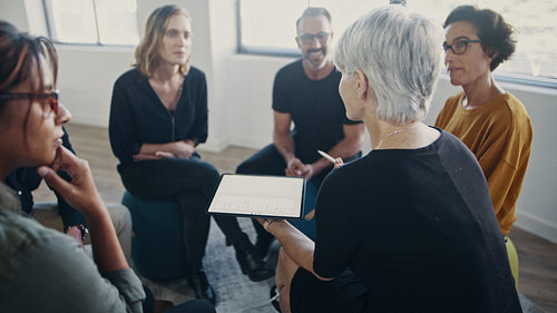 Professionals laughing during team building training session