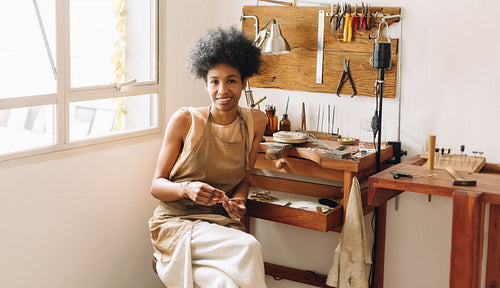 Female crafts person in jewelry studio