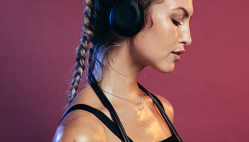 Female athlete resting after exercising