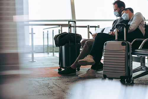 Couple during covid-19 outbreak waiting for delayed flight