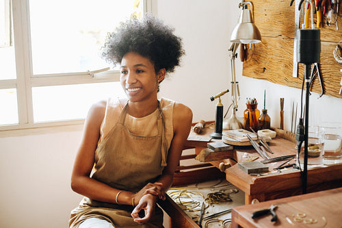 Woman sitting in ornament workshop