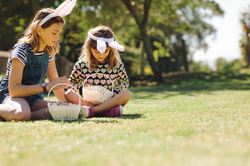 Kids sitting in the garden and playing