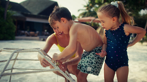 Family actively participating in marine conservation and restoration