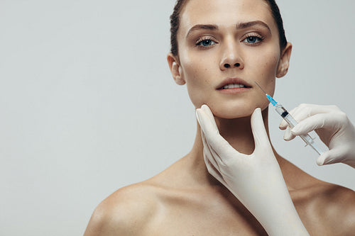 Woman getting cosmetic injection