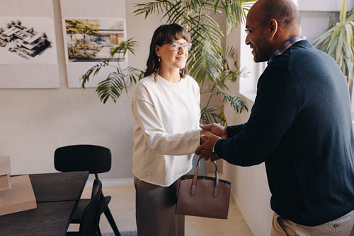 Professional business meeting with a successful handshake in modern office setting