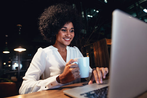 Young businesswoman working on the laptop at late night