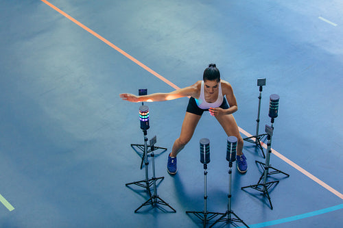 Female athlete with visual stimulus system at gym