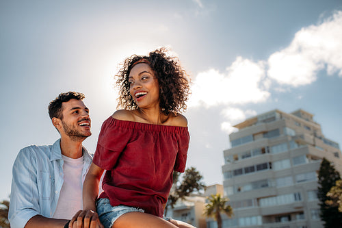 Happy couple riding on a bicycle