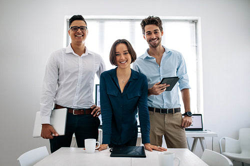 Business colleagues standing in meeting room