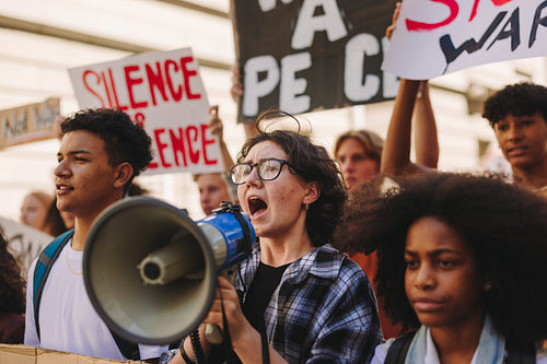 Multicultural young people protesting against war and violence