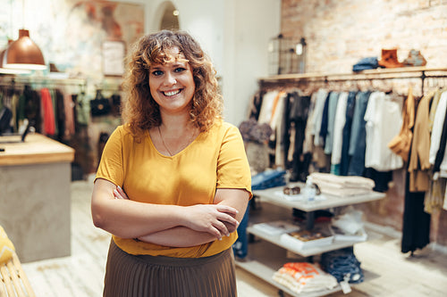 Happy fashion boutique owner