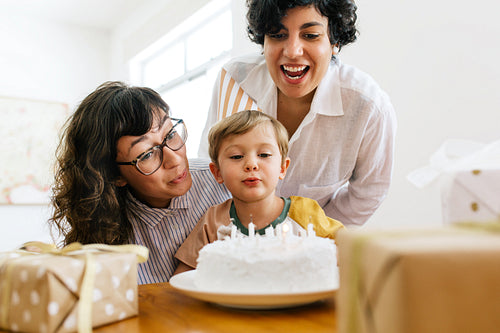 Couple celebrating birthday of their son at home