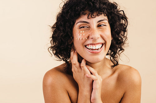 Body positive young woman laughing cheerfully