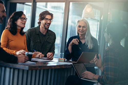 Happy group of people having meeting in office