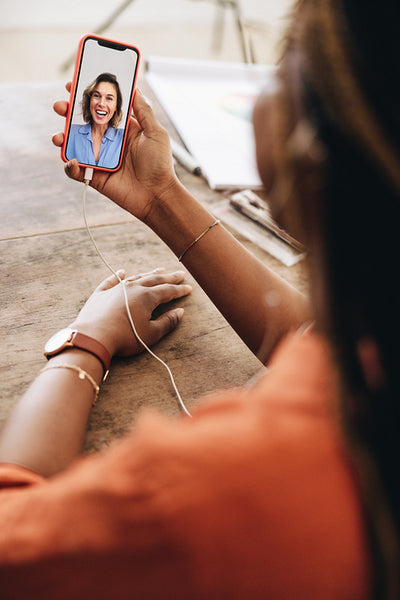 Woman taking a video call in her home office