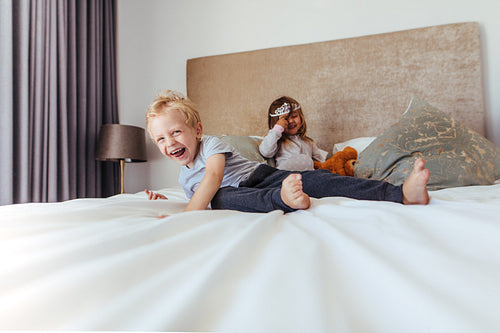 Happy kids playing in bedroom