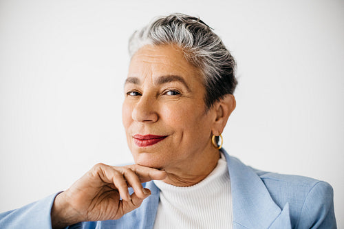 Empowered and successful business woman looking at the camera in an office