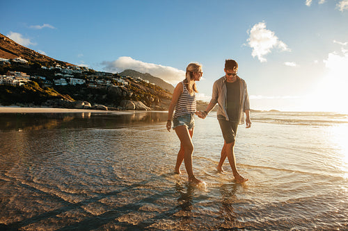 Young couple  strolling on the sea shore