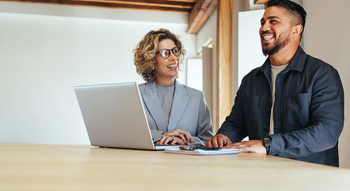Happy business colleagues working together in an office