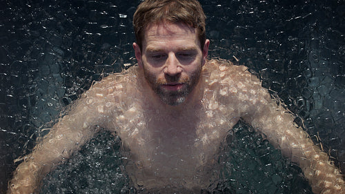 Cold recovery defines the moment as a man submerges in an outdoor ice bath