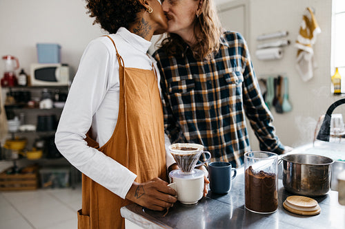 Young couple enjoys a cozy coffee break in the kitchen