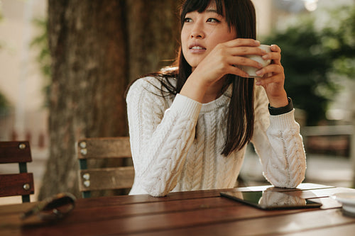 Attractive young woman at outdoor cafe