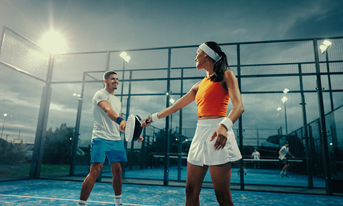 Energetic sports competition with athletes on padel court