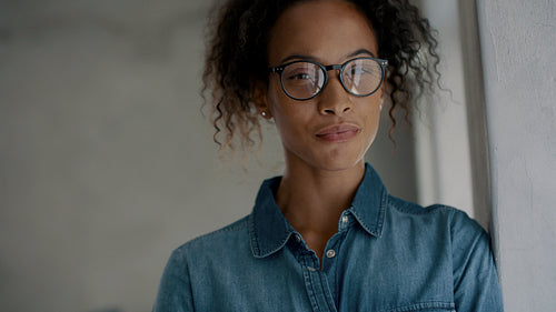 Cheerful businesswoman standing in office