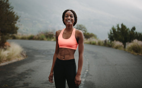 Young woman athlete on road