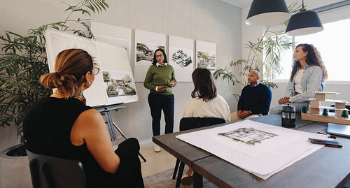 Team meeting discussing project scope and planning in modern office