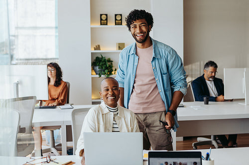 Successful startup team collaborating and planning in office