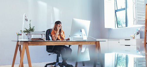 Female entrepreneur at work in her office