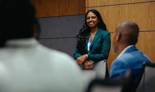Young confident Indian lawyer engaging in a professional meeting