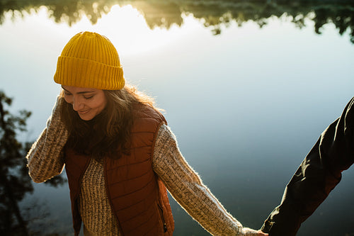 Woman walking by the lake with her man